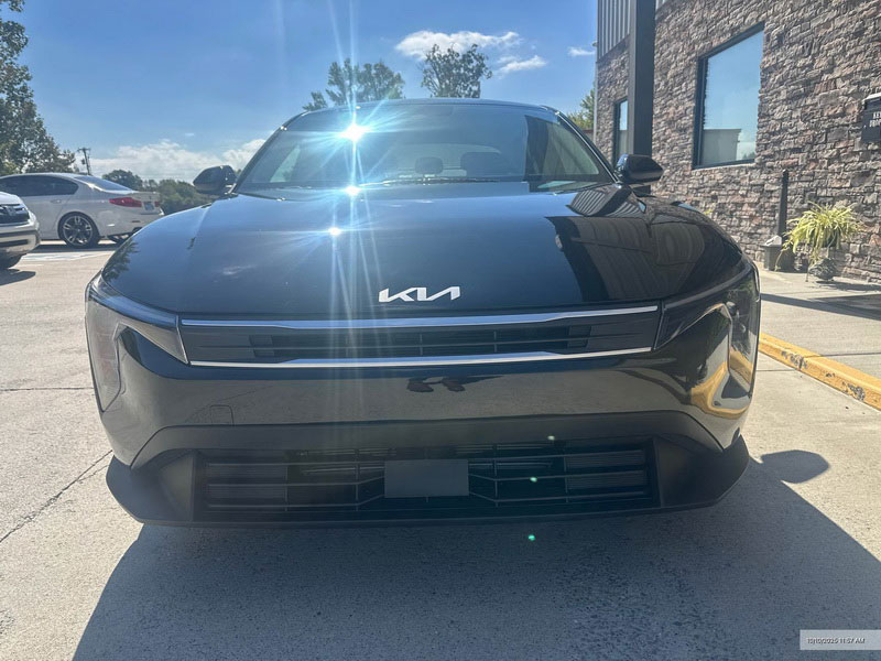 Front view of a black Kia EV6 showing professional auto body repair and expert paint work at Plan B Auto Body.